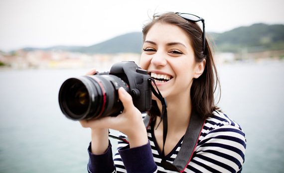 Woman holding a camera.