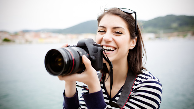 Woman holding a camera.