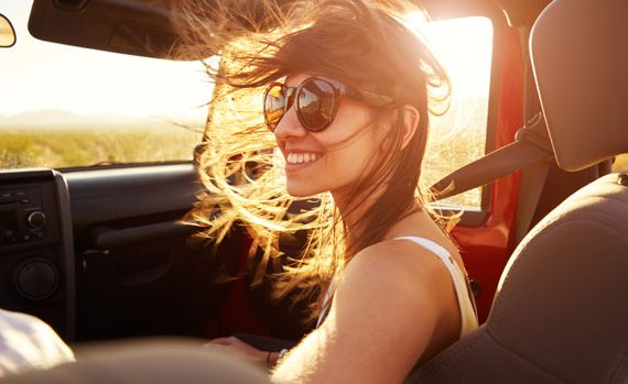 Woman in passenger seat of car