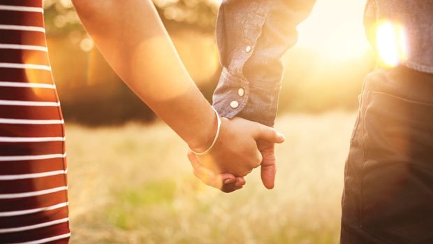 Couple holding hands