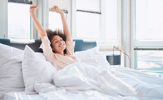 Woman waking up in bed