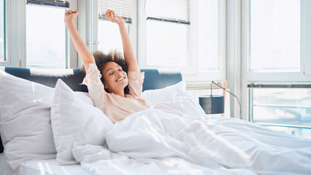 Woman waking up in bed