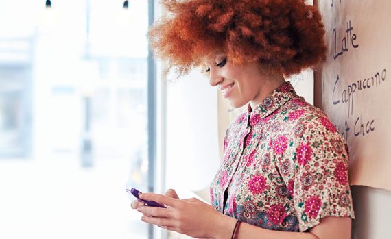 Woman tweeting on her phone