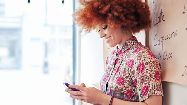 Woman tweeting on her phone