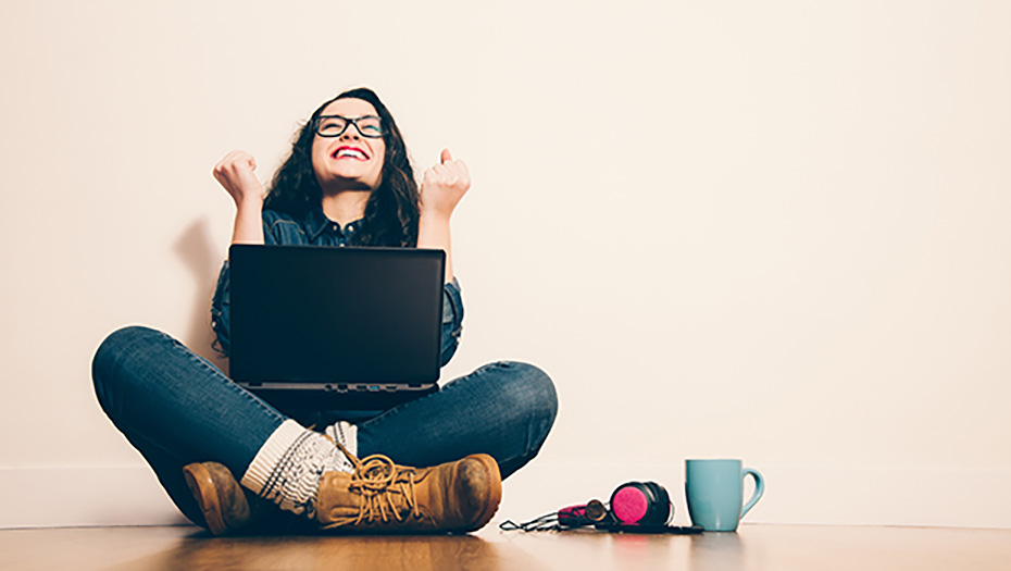 Excited girl with laptop