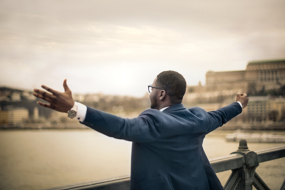 Man looking out into a bay, finding purpose