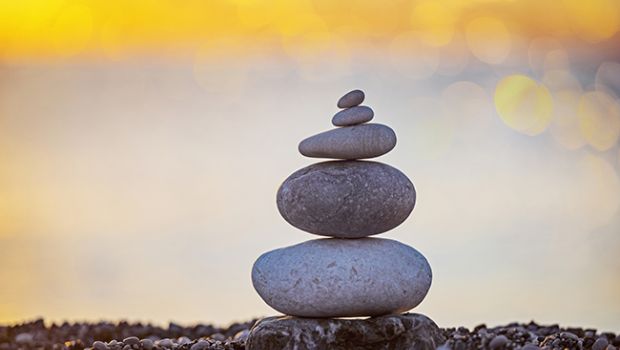 stack of zen stones on pebble beach