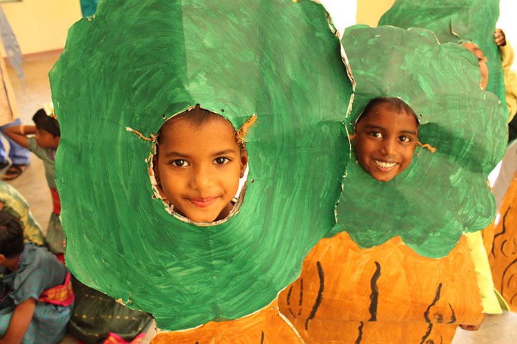 Two young children with arts and crafts