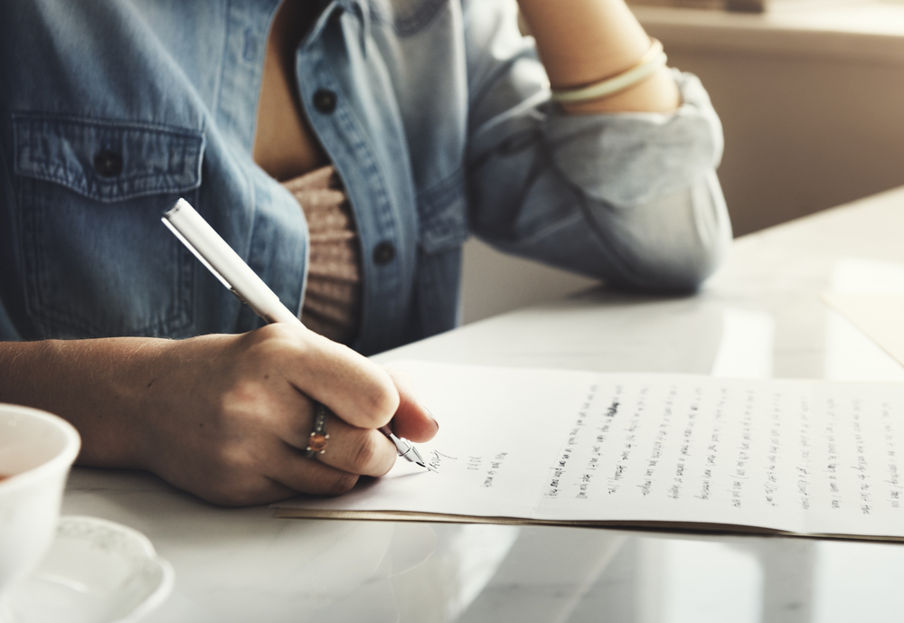 Girl Writing Letter Home Concept