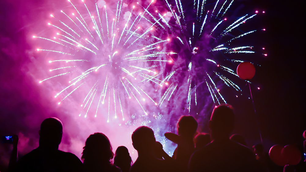 Crowd watching fireworks and celebrating